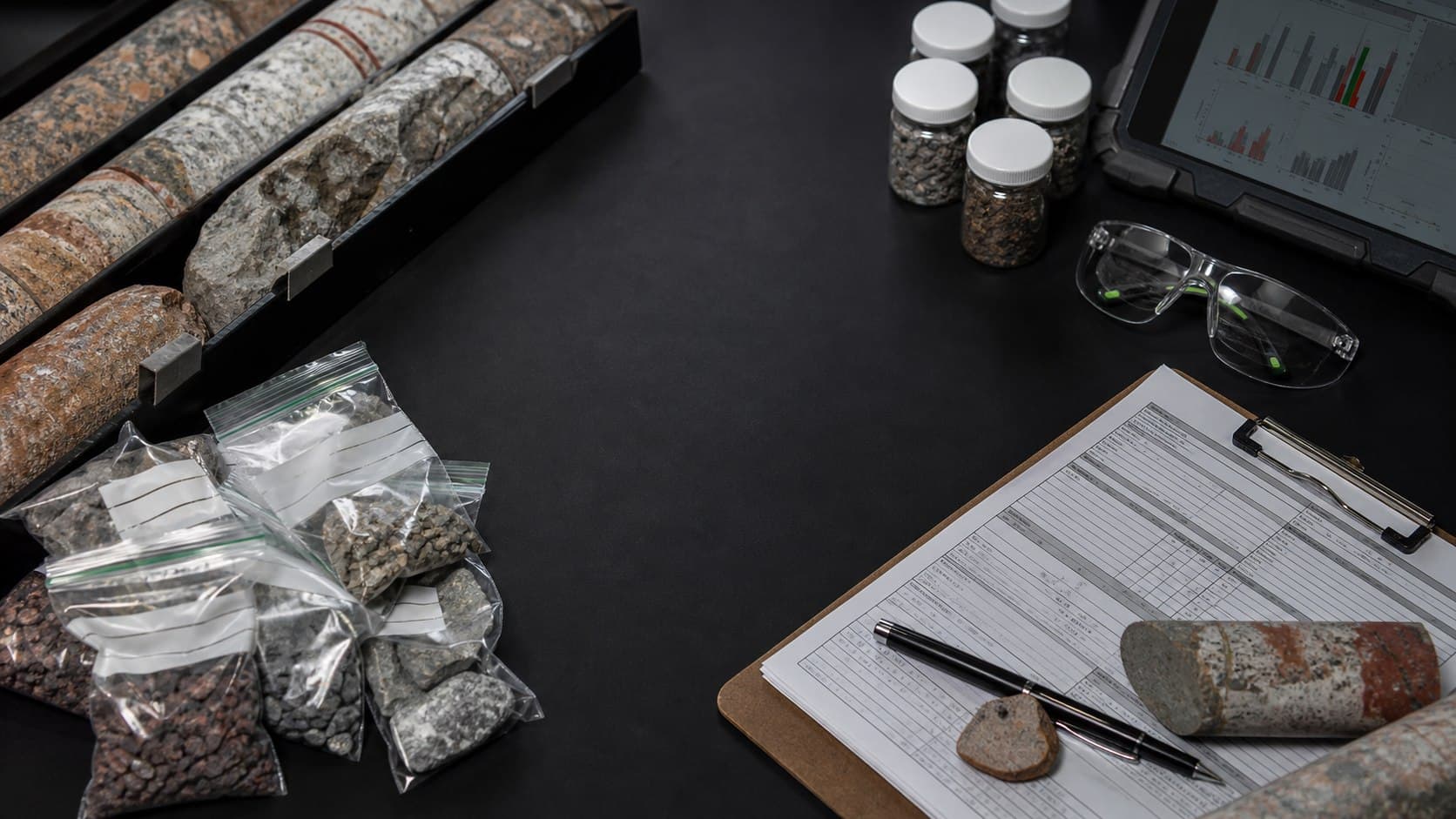 Geological samples and chain-of-custody documents on a laboratory bench